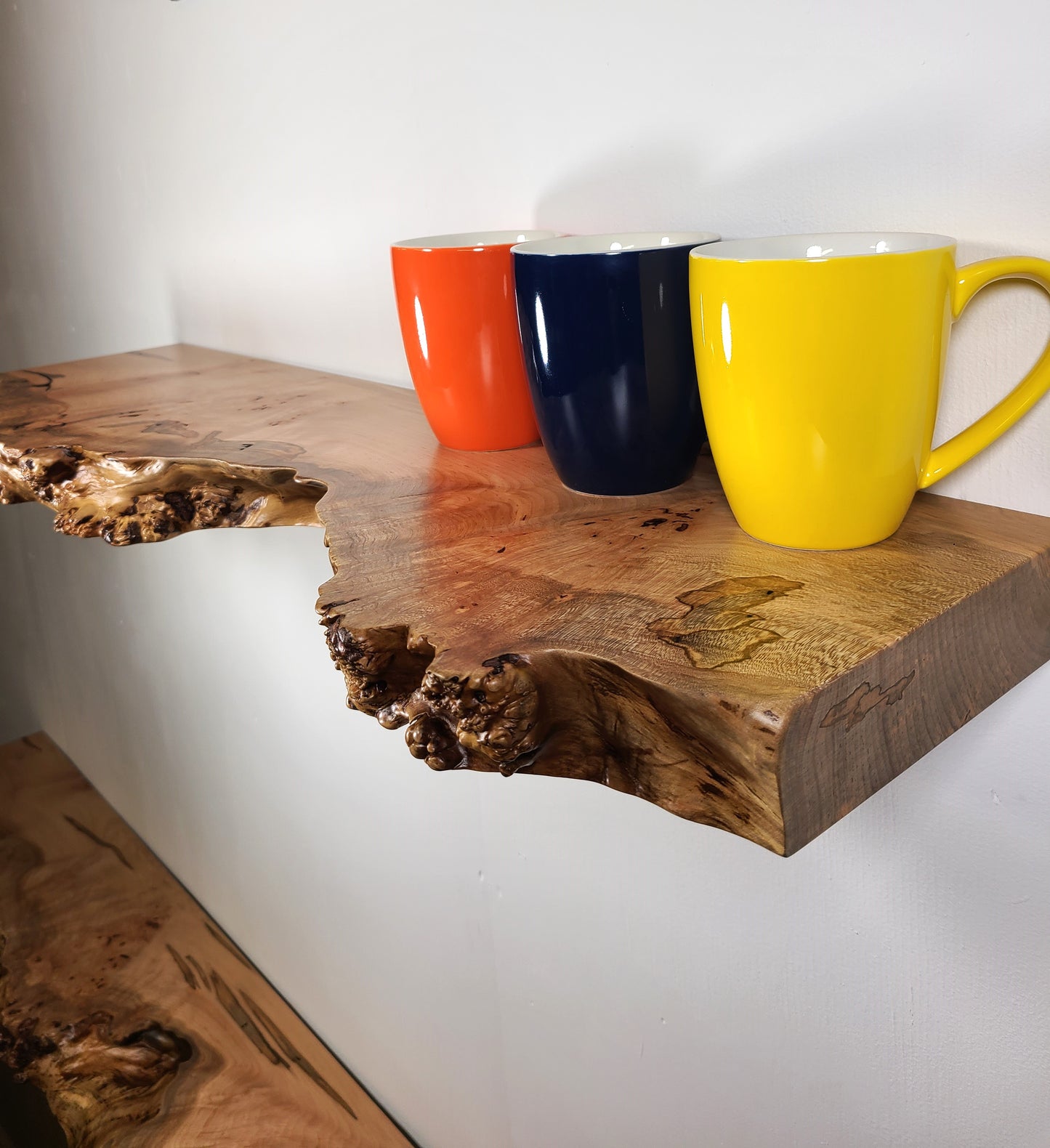male live edge shelf which include burls