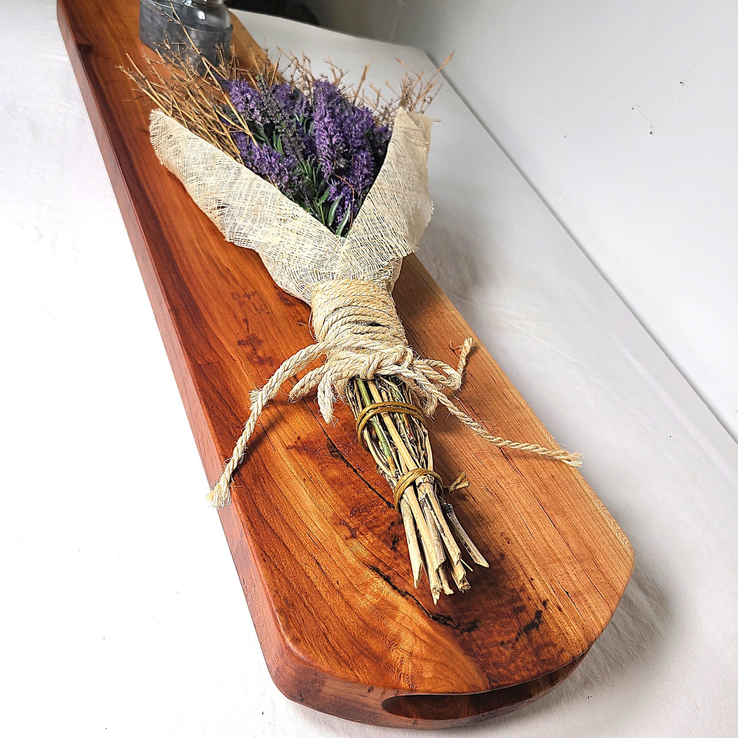 Bouquet of lavender tied with twine on a wooden tray centerpiece or charcuterie