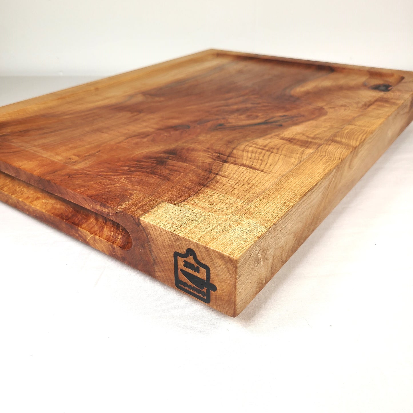 side view of a 2 inch thick maple cutting, carving or charcuterie board. Made in USA using local and ethically sourced wood by ZimBoards