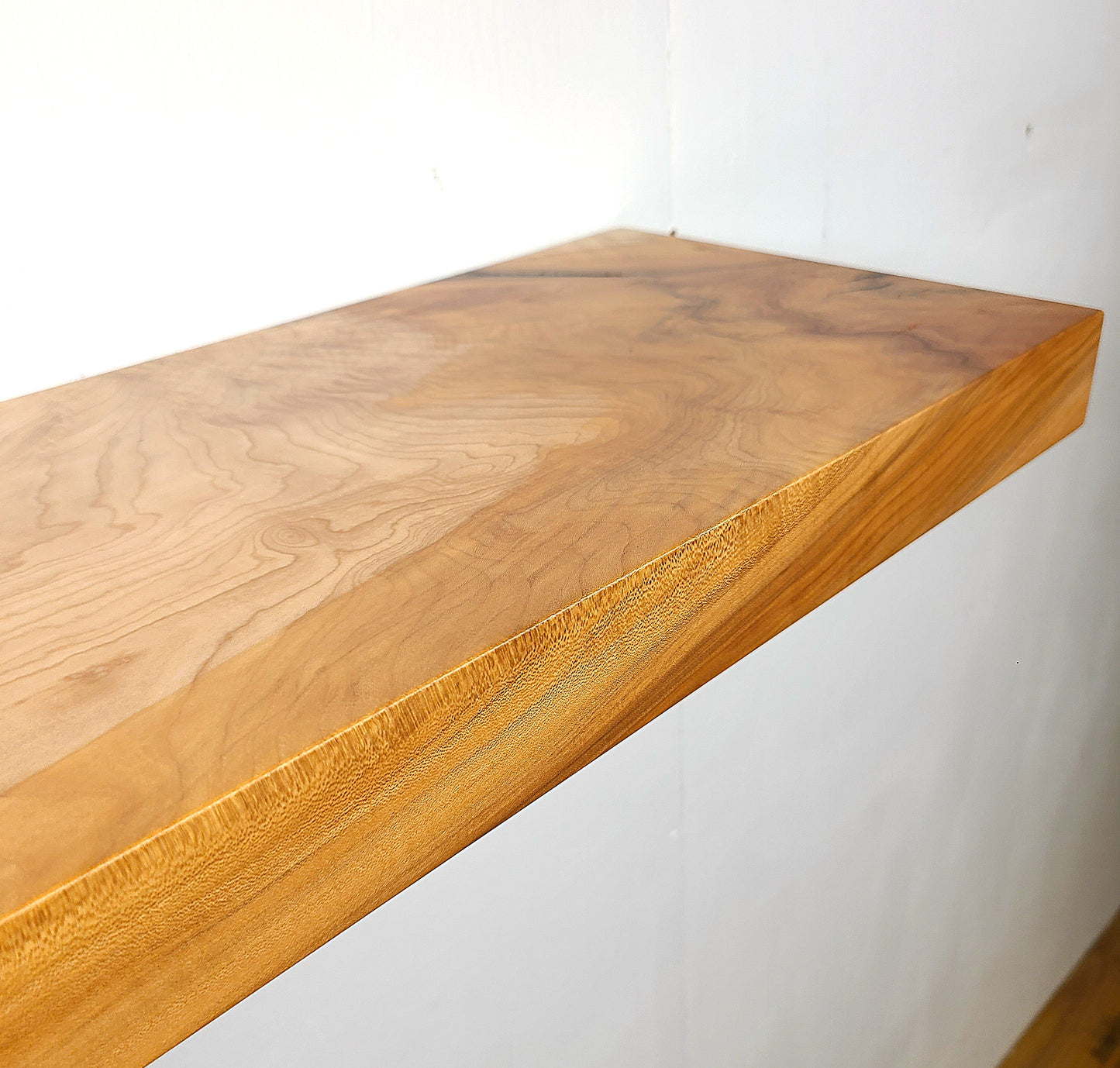 close up of wood floating shelf