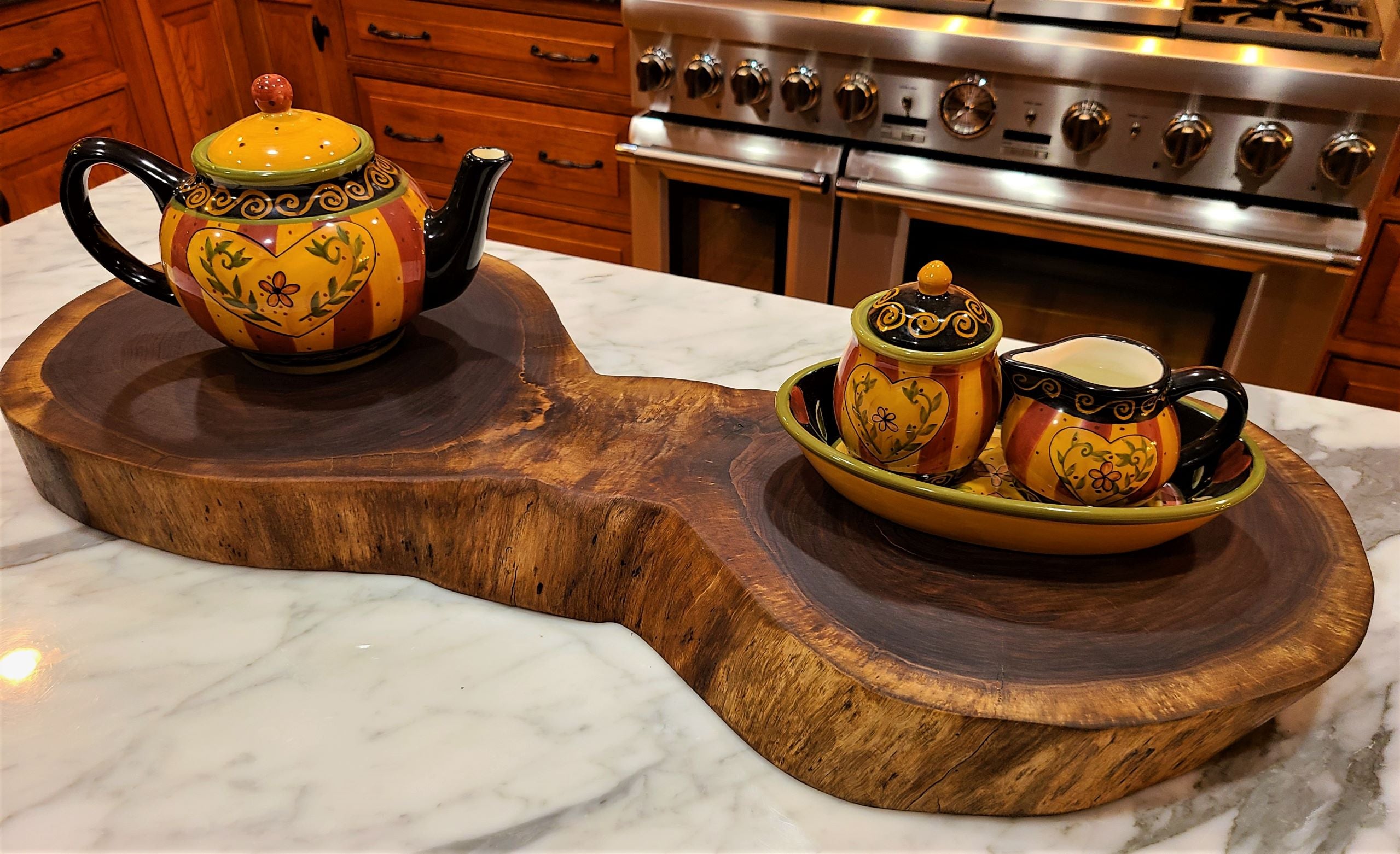 Black Walnut double crosscut used as a kitchen island centerpiece or large charcuterie board. Charcuterie/ Grazing Solid Wood Cutting Board made in Lancaster Pennsylvania USA by ZimBOARDS