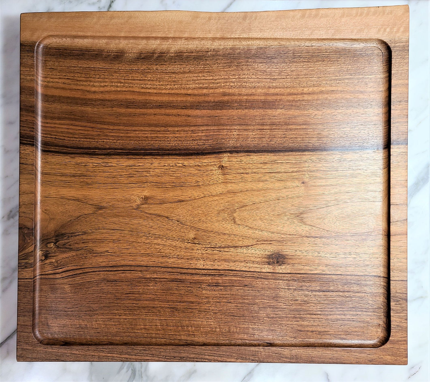 Large Live edge Walnut carving board. Top view of this custom cutting board made in USA by ZimBoards.