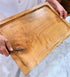 Person holding a custom made large cutting, carving board.  Maple from a thick piece of Maple.  Made in USA by ZIM Boards.