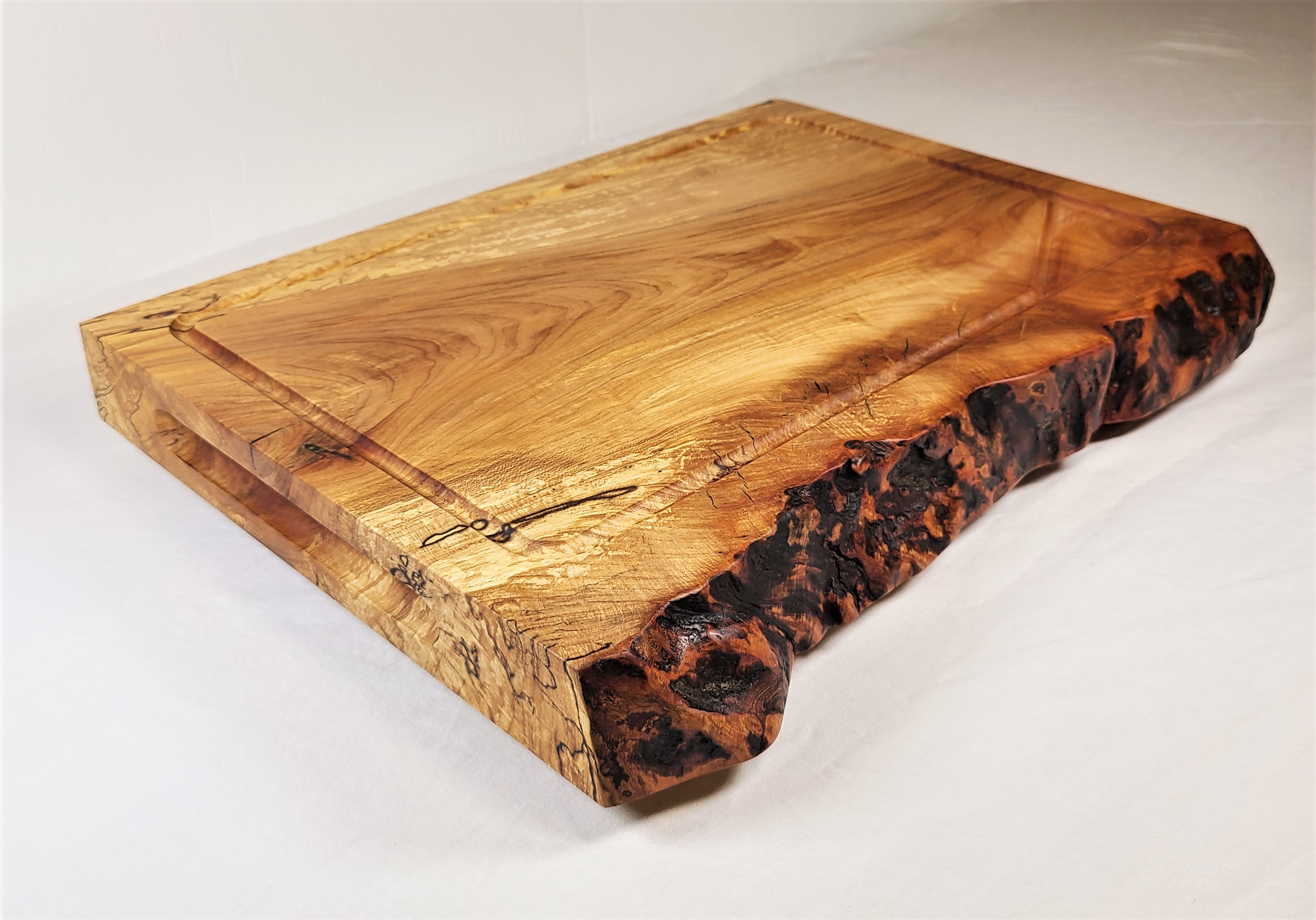 Solid Sugar Maple Wood Cutting Board featuring a natural live edge and 2" board thickness