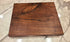 walnut cutting board with a flat cutting surface used to cut up fruits and vegetables 