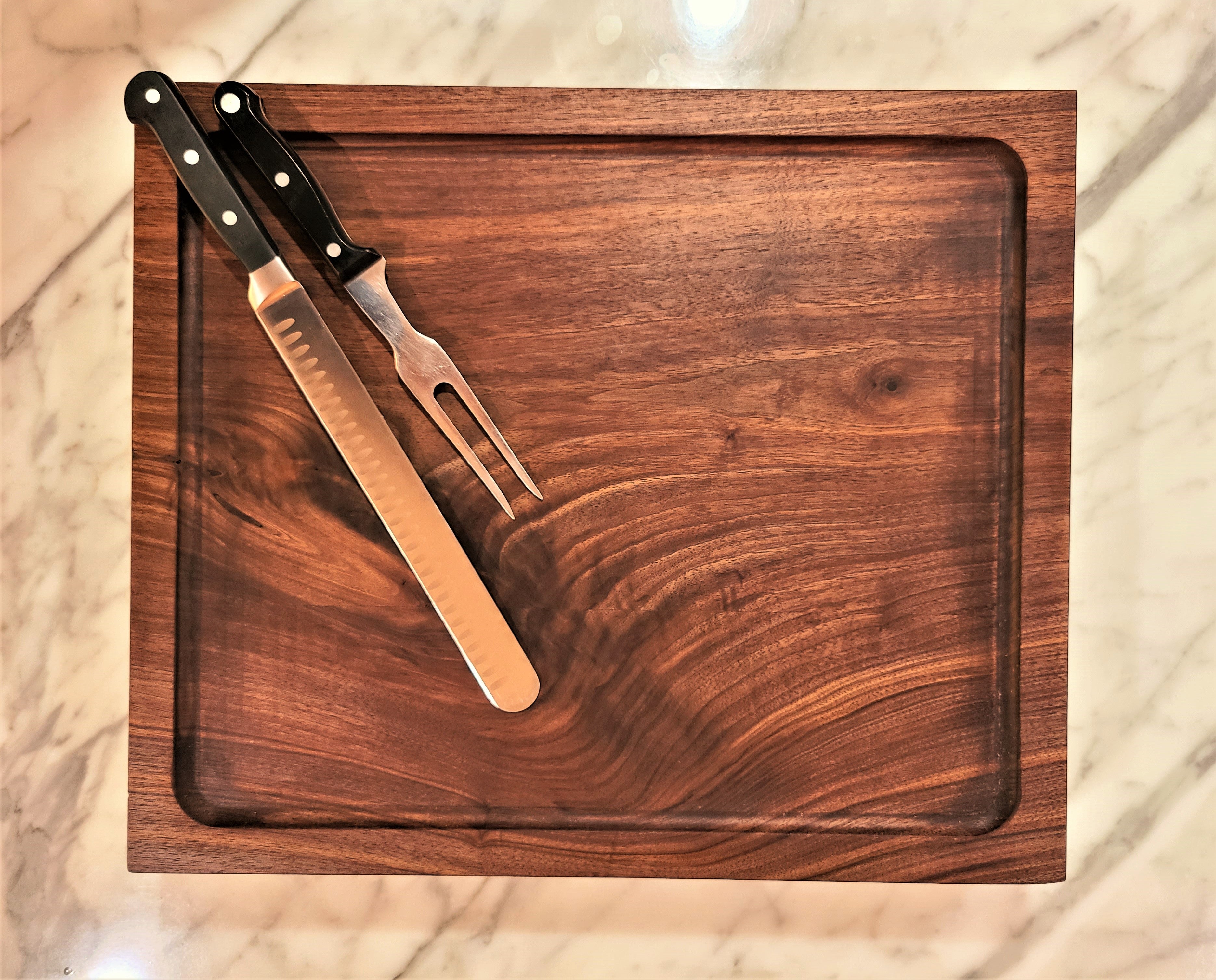 walnut carving board with routed juice pocket used to hold meat juices 