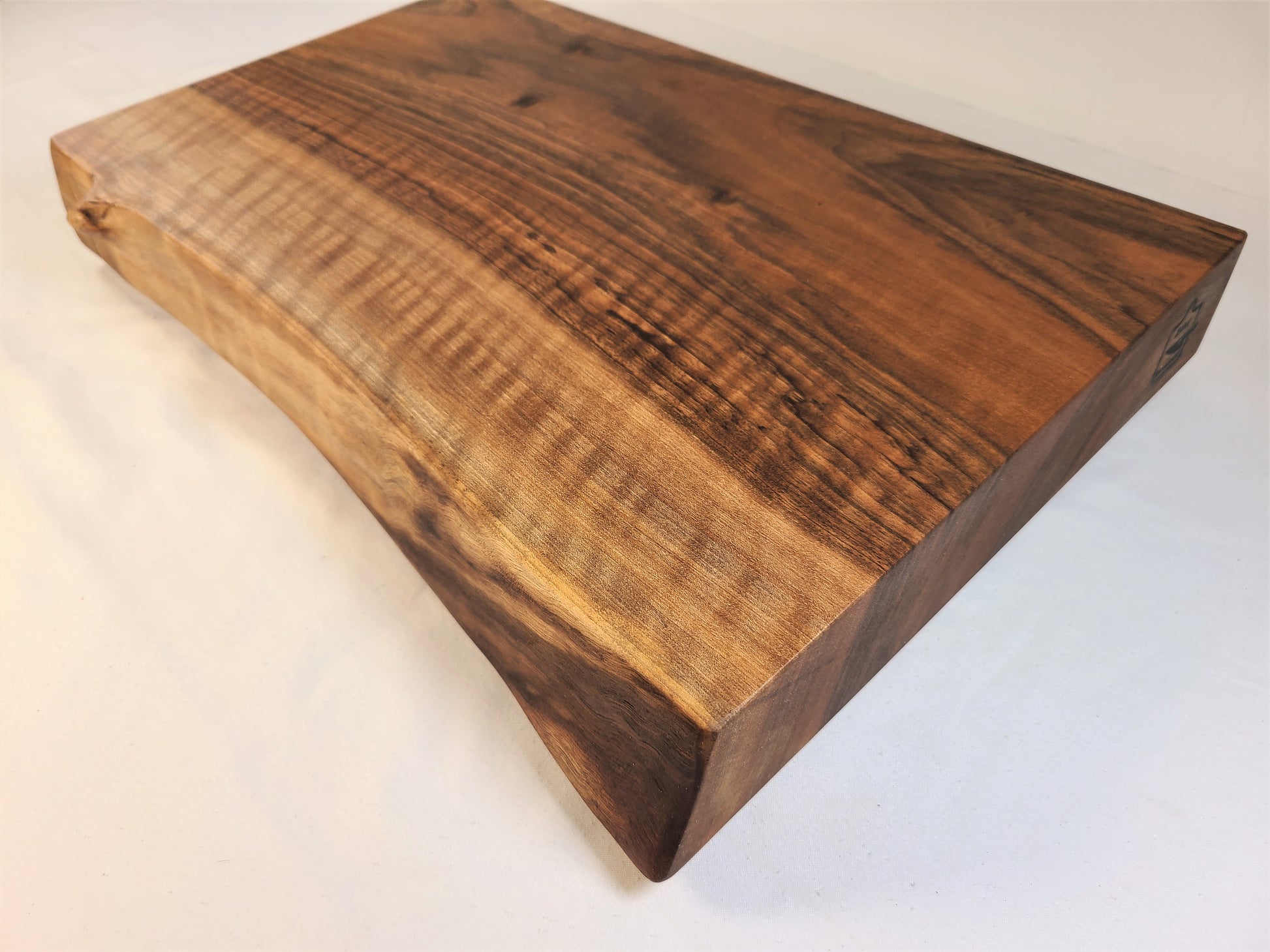 corner view showing 2 inch thickness of a solid wood cutting board