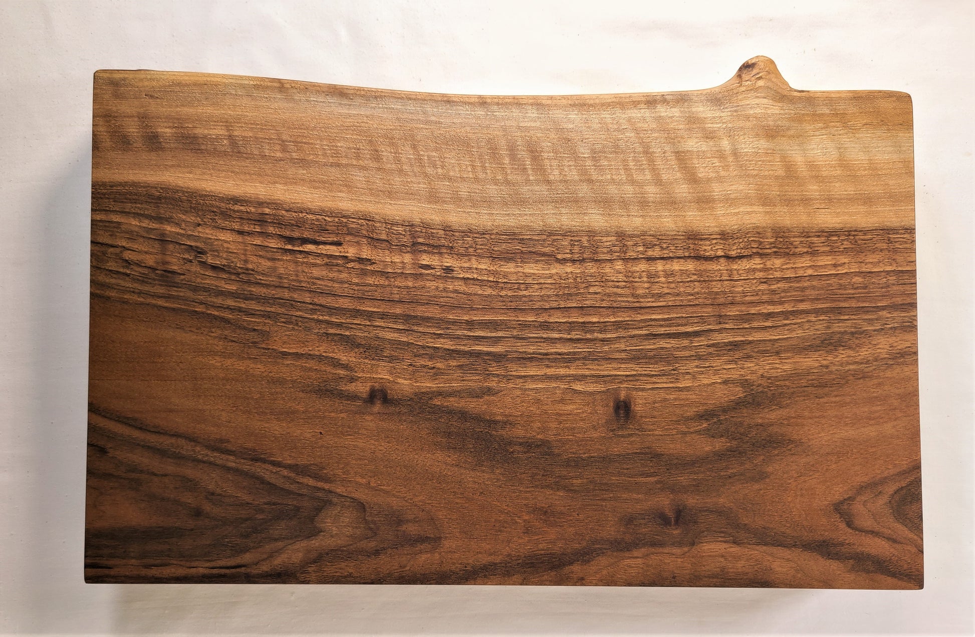 walnut live edge cutting board with beautiful grain
