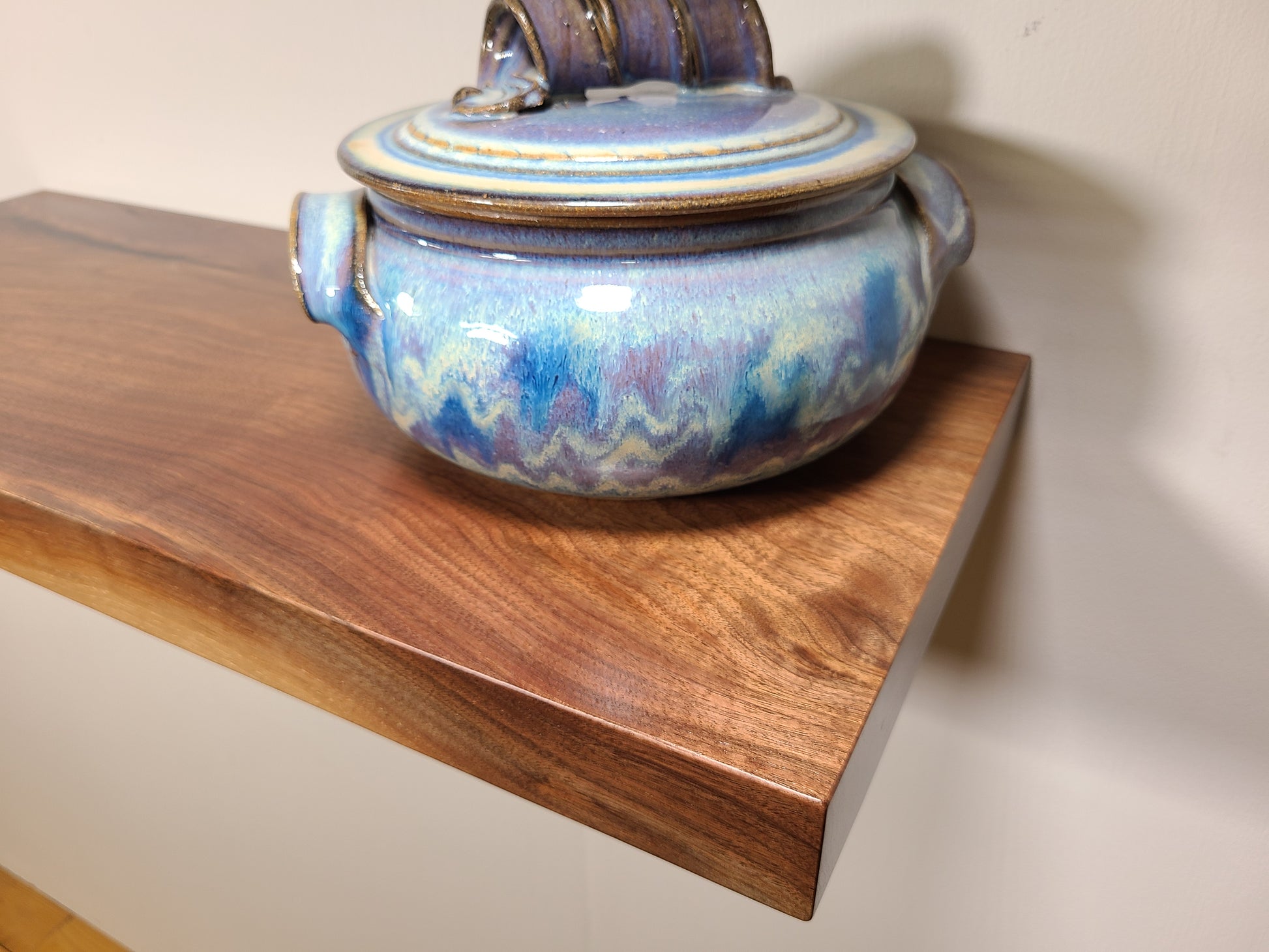 A solid walnut floating shelf  