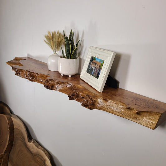 live edge floating shelf made of elm with a burly edge
