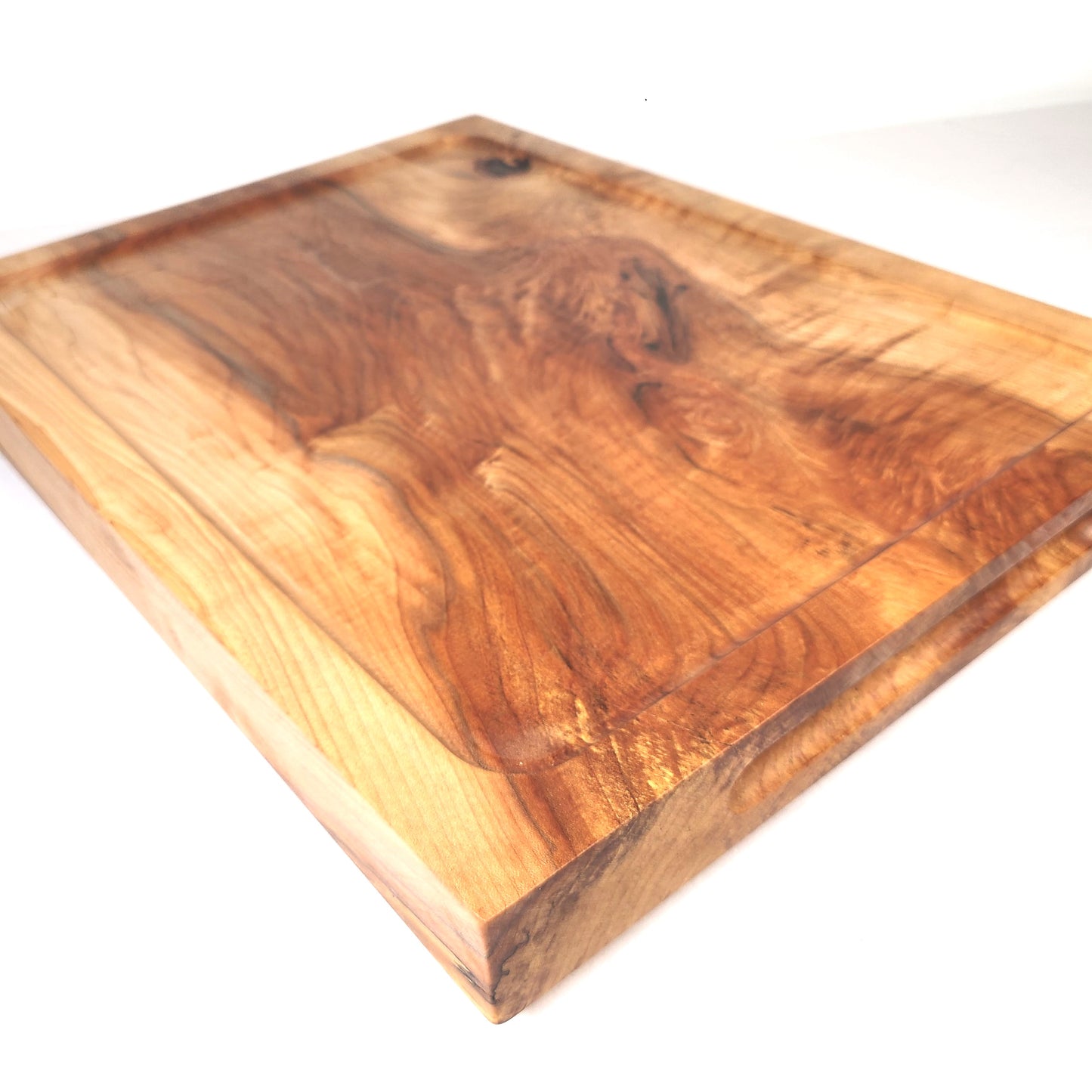 Carving Board made of 2 inch thick maple.  This large wood cutting or charcuterie board can handle any brisket, turkey with ease. Made in Lancaster County Pennsylvania USA by ZimBoards.  Can be personalized