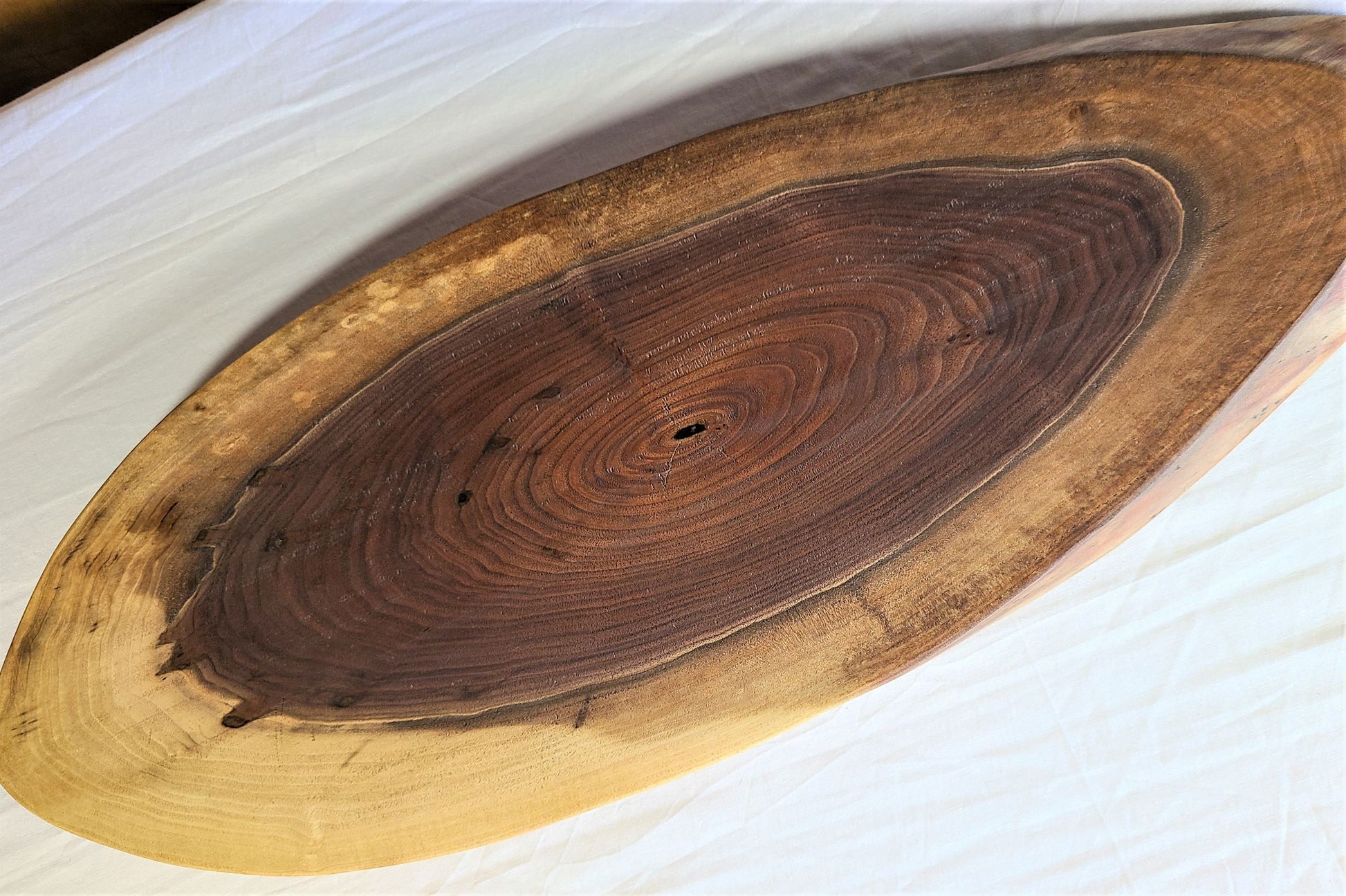 IMpress your guests with this live edge oval wood charcuterie board.  Made in USA by Zimboards