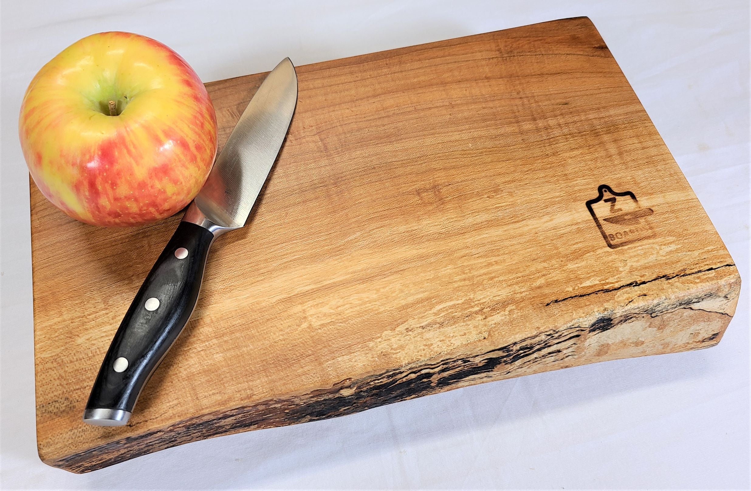 Live edge maple wood cutting board that will become the cutting board you reach for everyday.  Made in USA by ZimBoards