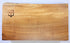 Maple cutting board.  This kitchen cutting board features a live edge.  This thick maple wood cutting board also loos great as a charcuterie or serving board. Made in USA by ZIMboards board 
