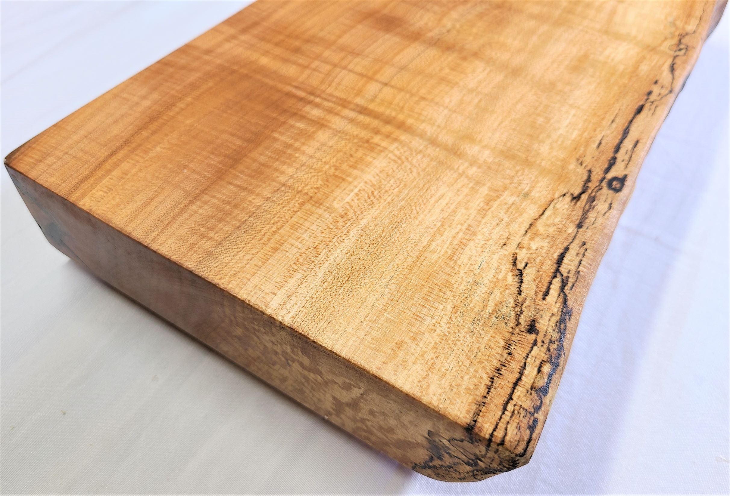THis view shows how thick our maple wood cutting board is.  Loads of character in this thick solid wood cutting board.  Made in USA by ZIMboards