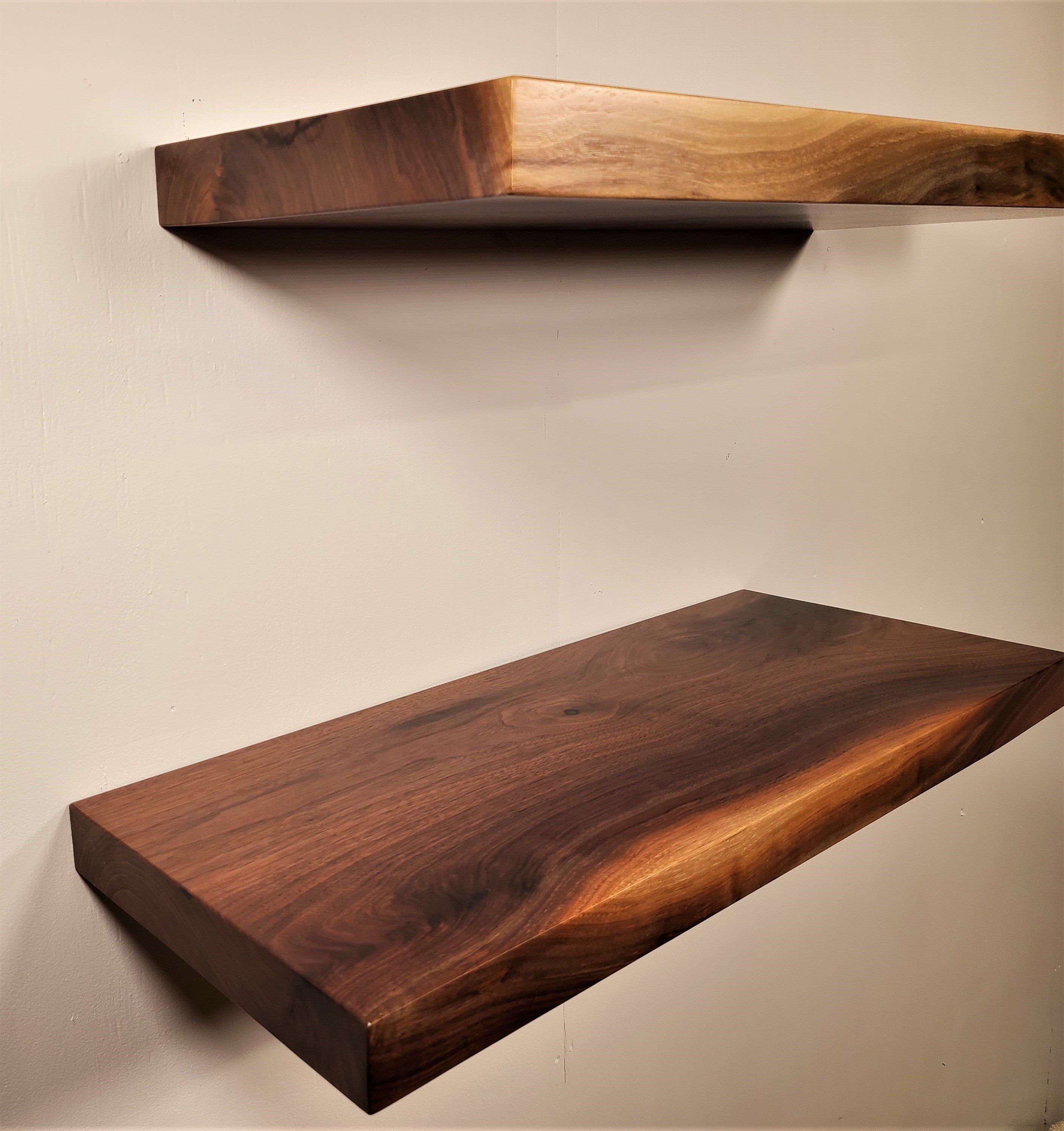 corner edge view of 2 thick walnut solid wood floating shelves made by Zimboards.