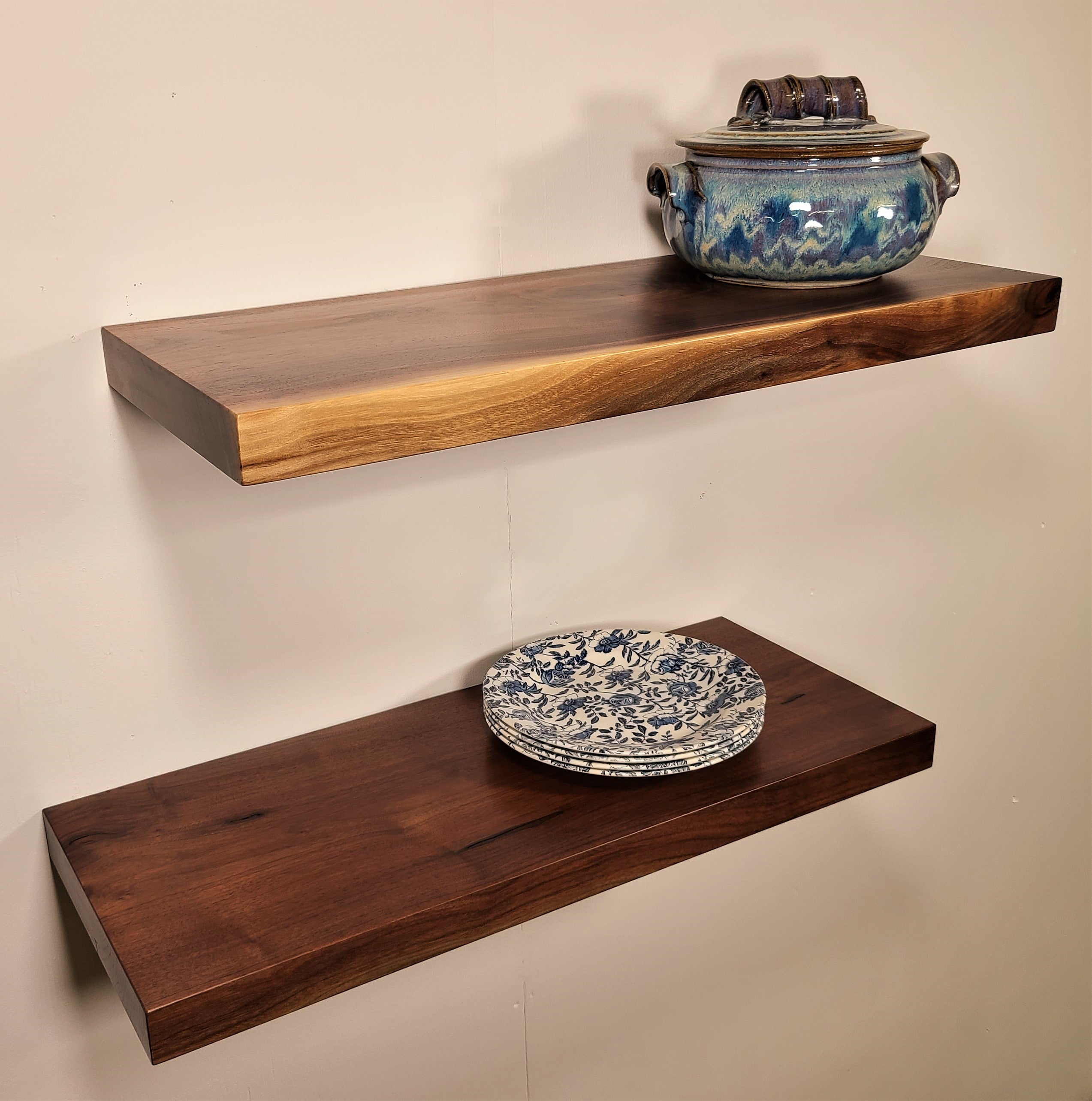 front and  side view of 2 floating shelves made from thick solid walnut wood.  Shown with a flat edge for modern rustic or Farmhouse decor.  Custom made in Lancaster Pennsylvania by Zimboards. 