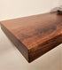 top corner picture of a solid walnut wood floating shelf  to show thickness and furniture grade finish made in Lancaster Pennsylvania by Zimboards.