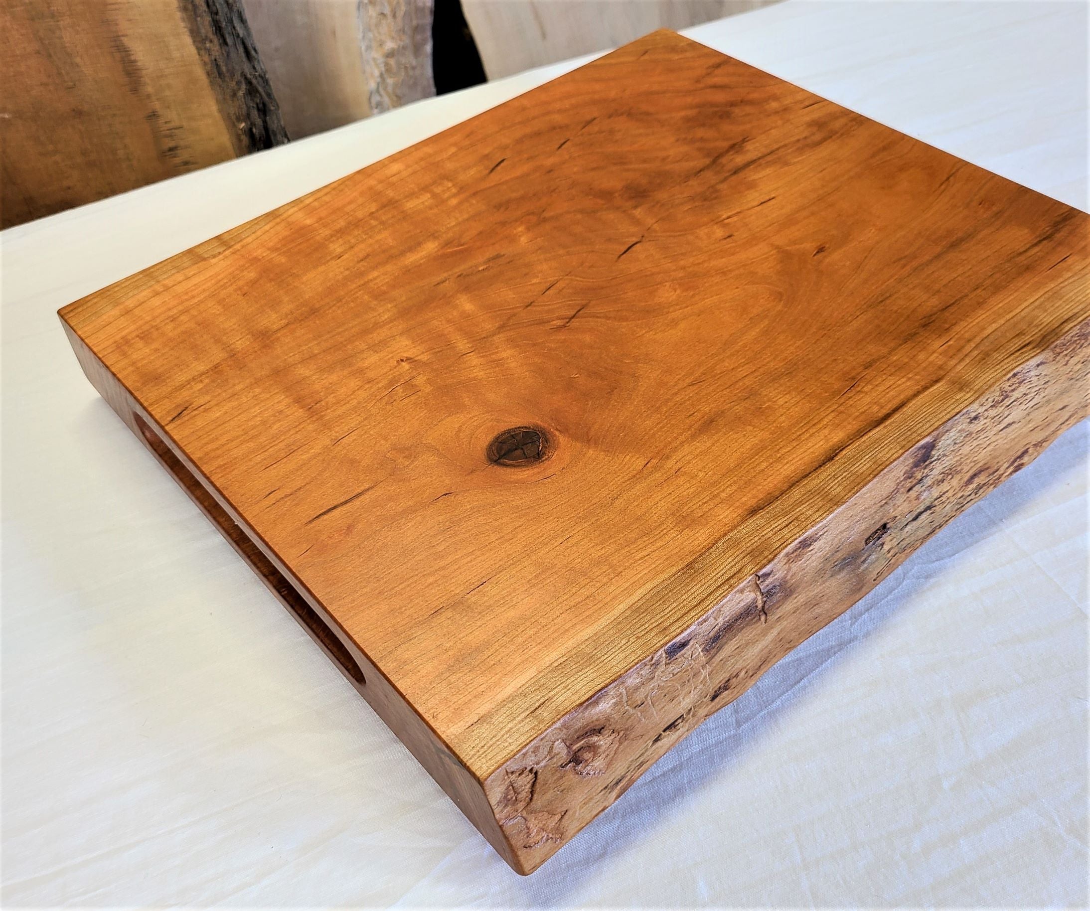 custom cutting board made of solid cherry.  Live edge charcuterie board, cutting, slicing or serving board.  Made in USA by ZimBoards