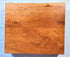 Wood cutting board made from 2" thick cherry.  Features a live edge and routed finger grooves.  Made in USA by ZimBoards.
