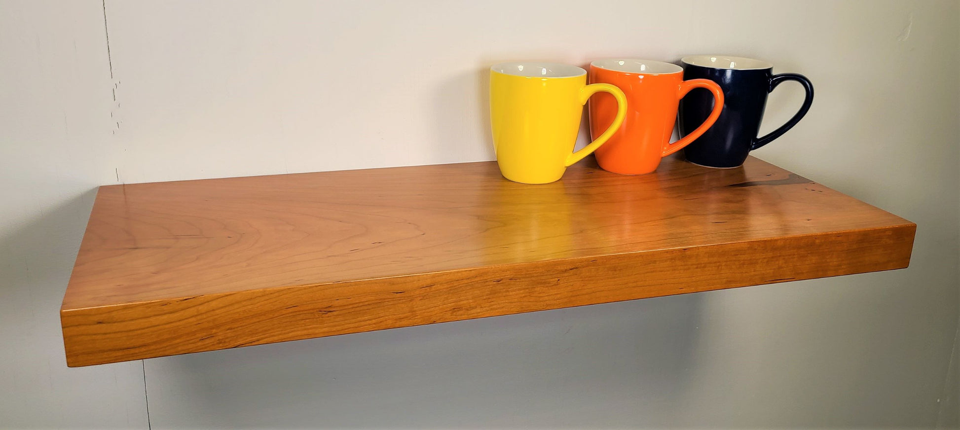 long natural wood floating shelves