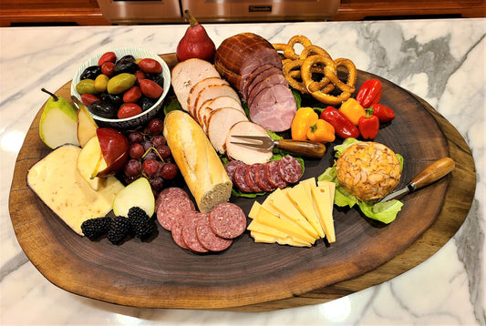 round charcuterie board full of delicious food ready to serve
