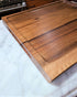 Large cutting board made from a solid piece of walnutLive edge custom cutting board made in USA by ZimBoards